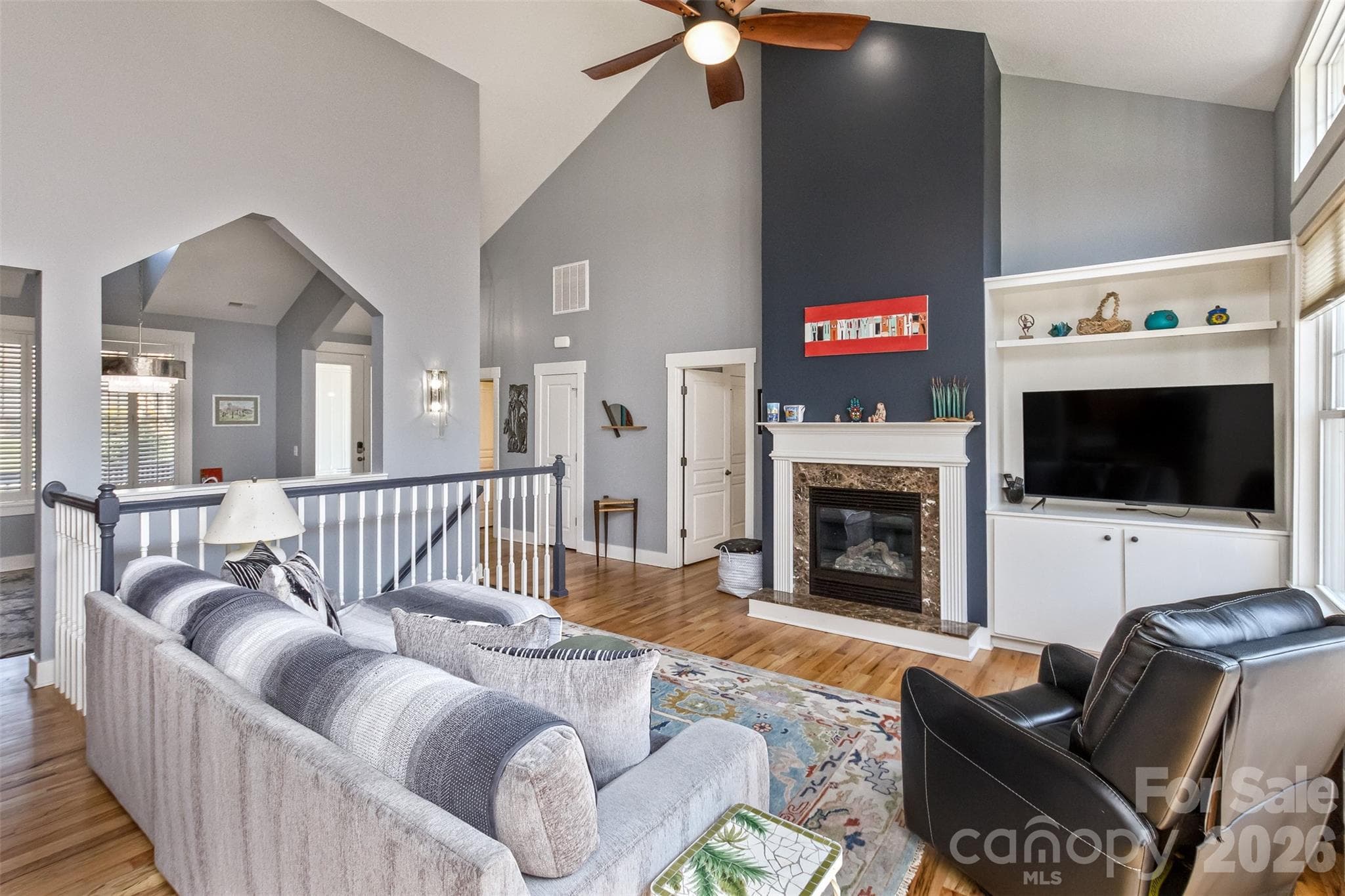 Living room with a cozy gas fireplace - 37 Creekside View Drive, Asheville