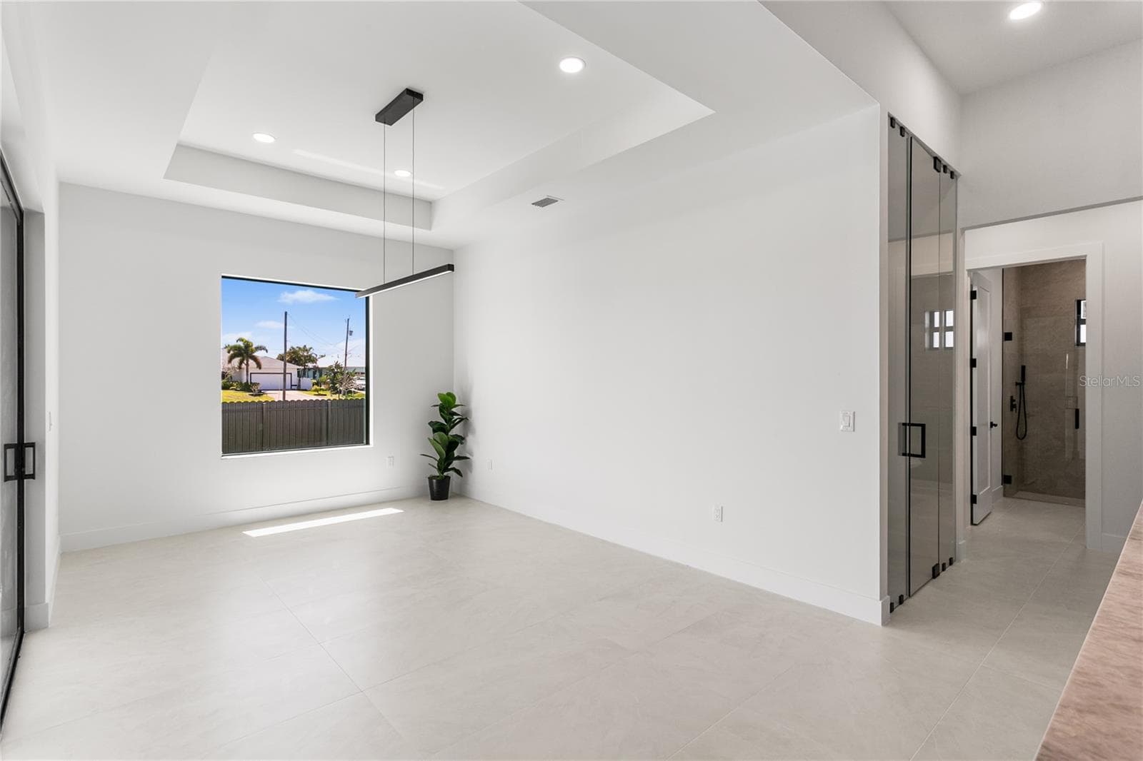 The FORMAL DINING AREA showcases a LARGE PICTURE WINDOW - 3300 NW 1ST TER, CAPE CORAL