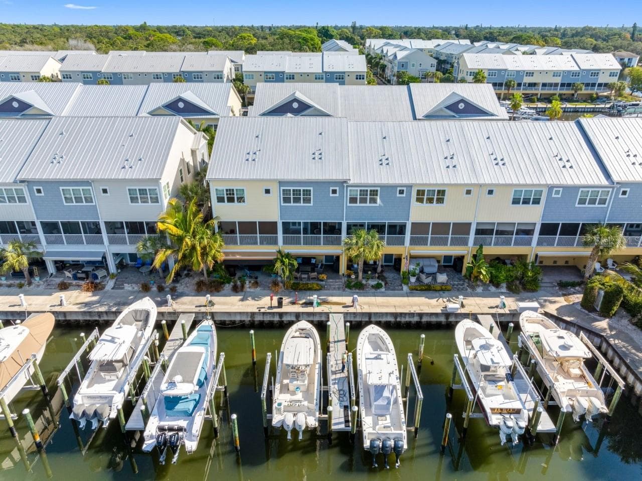 Rear view with wet slips and dock - 6057 MOORINGS DR S, ST PETERSBURG