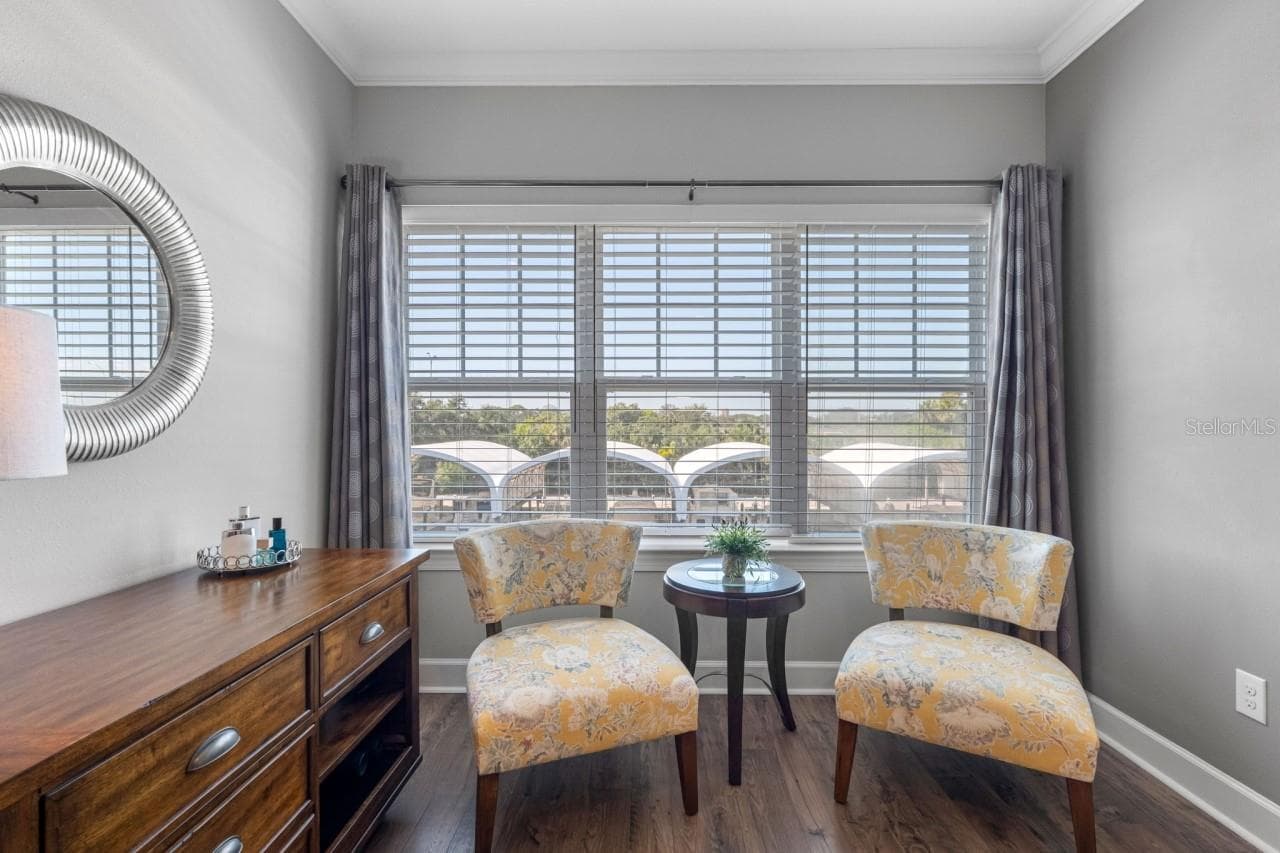 Primary Bedroom Nook with water views of possibly your own ?? boat - 6057 MOORINGS DR S, ST PETERSBURG
