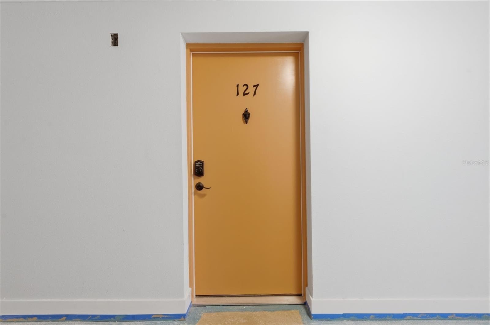 Unit 127, First door inside the hallway on the right. - 8901 BLIND PASS RD #127, ST PETE BEACH