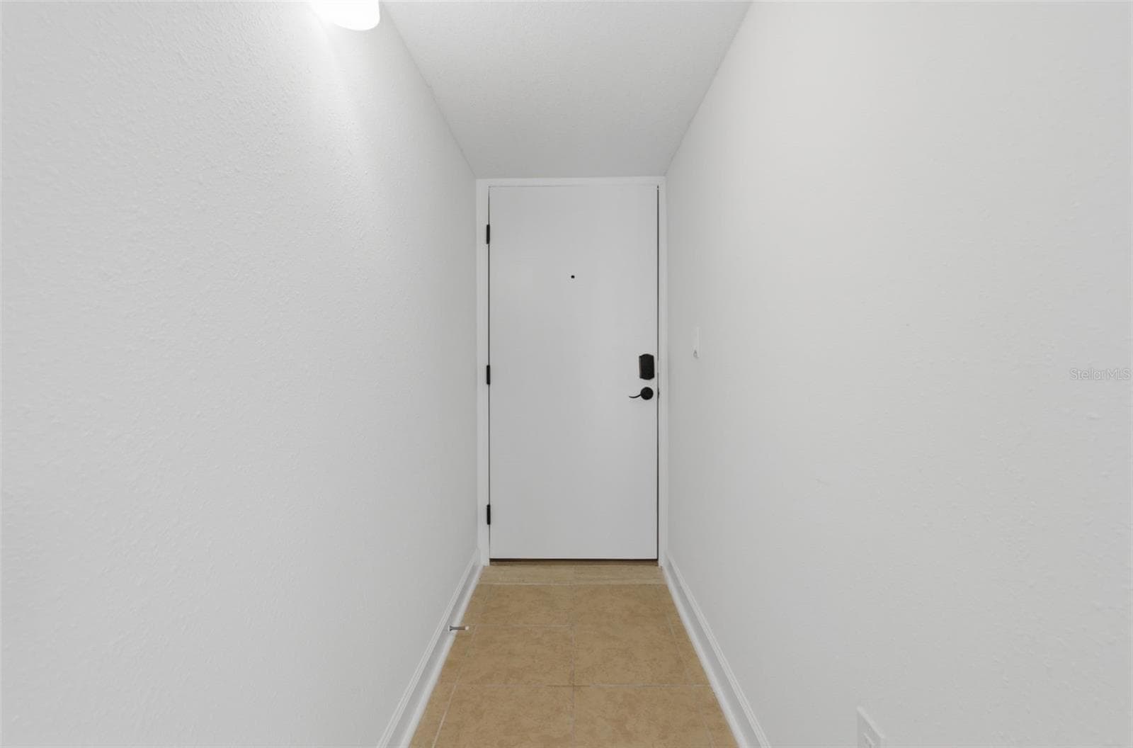 Step inside the door and a nice hallway faces you - 8901 BLIND PASS RD #127, ST PETE BEACH