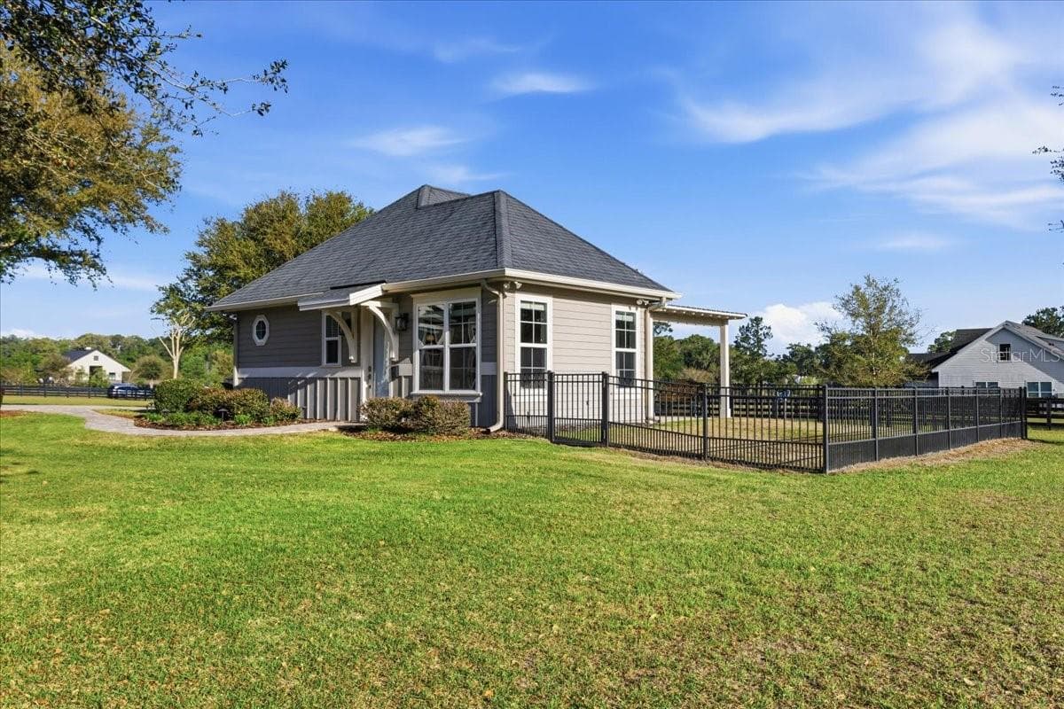 Detached guest house features two bedrooms, full kitchen, one bathroom, living area & stackable washer/dryer. - 10401 NW 153RD TER, ALACHUA