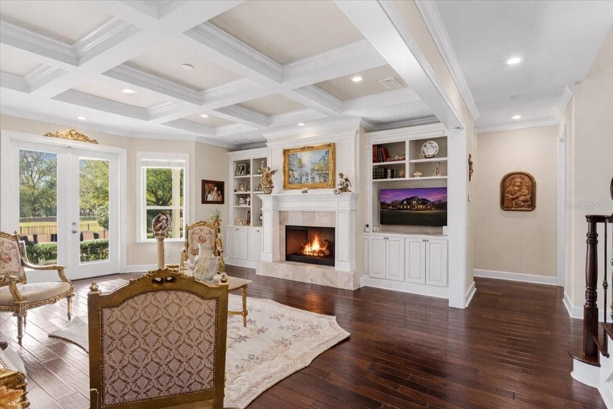 Custom coffered ceiling in formal living room. Custom built-ins surrounding gas fireplace. - 10401 NW 153RD TER, ALACHUA