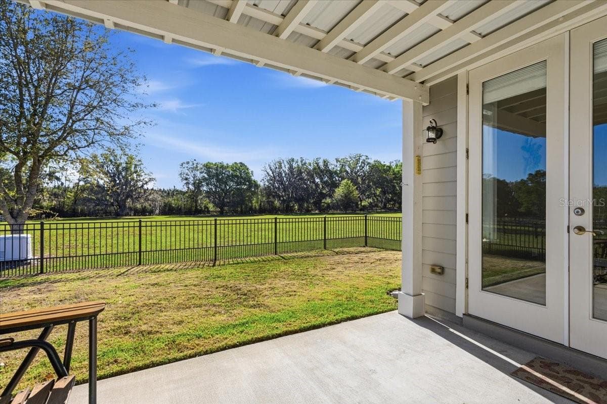 Covered Guest House lanai with fenced yard and generator - 10401 NW 153RD TER, ALACHUA