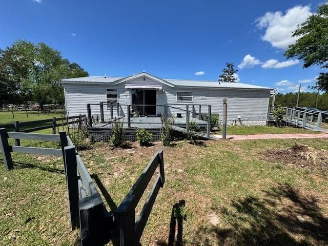 Back of home with deck - 19231 NW HIGHWAY 335, WILLISTON
