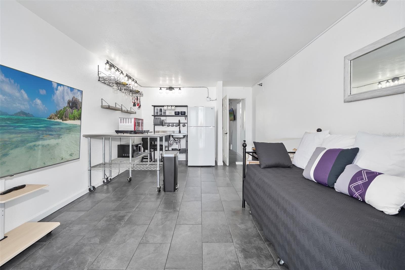 Open area, tiled floors - 701 S ATLANTIC AVE #516, DAYTONA BEACH