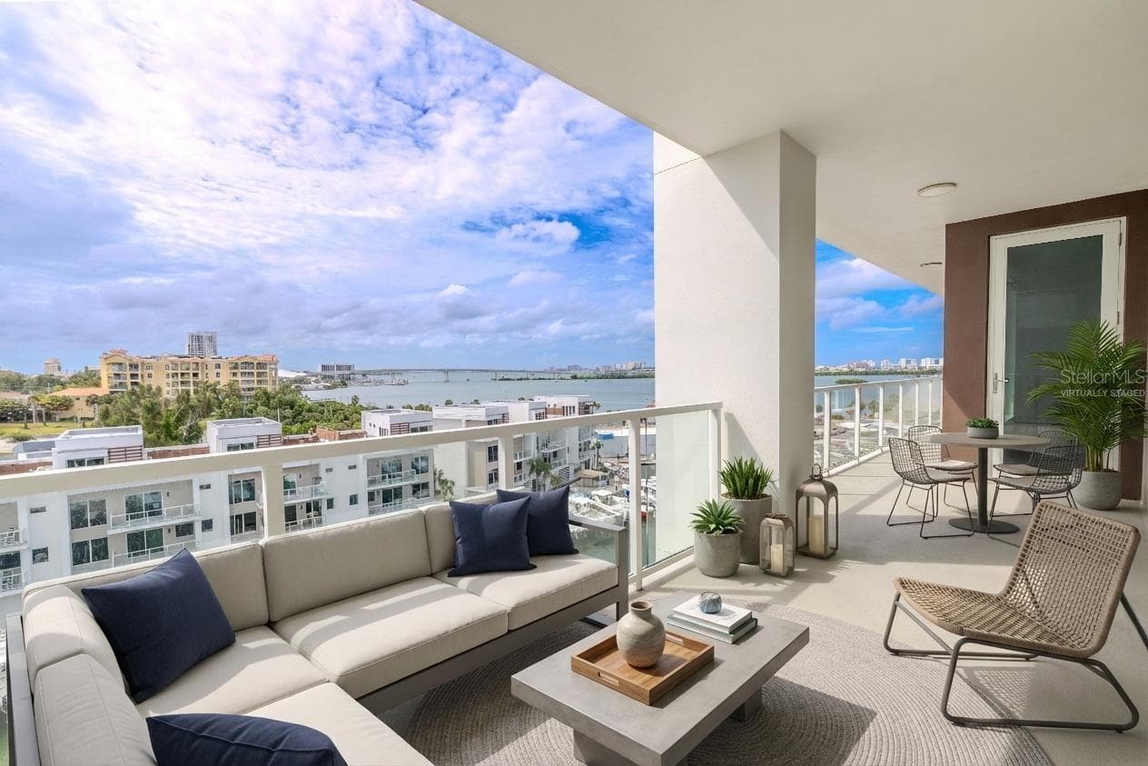 Perfect for morning coffee or evening cocktails, the balcony offers the ultimate setting to soak up the Gulf breeze and panoramic waterfront vistas. Virtually staged photo. - 920 N OSCEOLA AVE #703, CLEARWATER