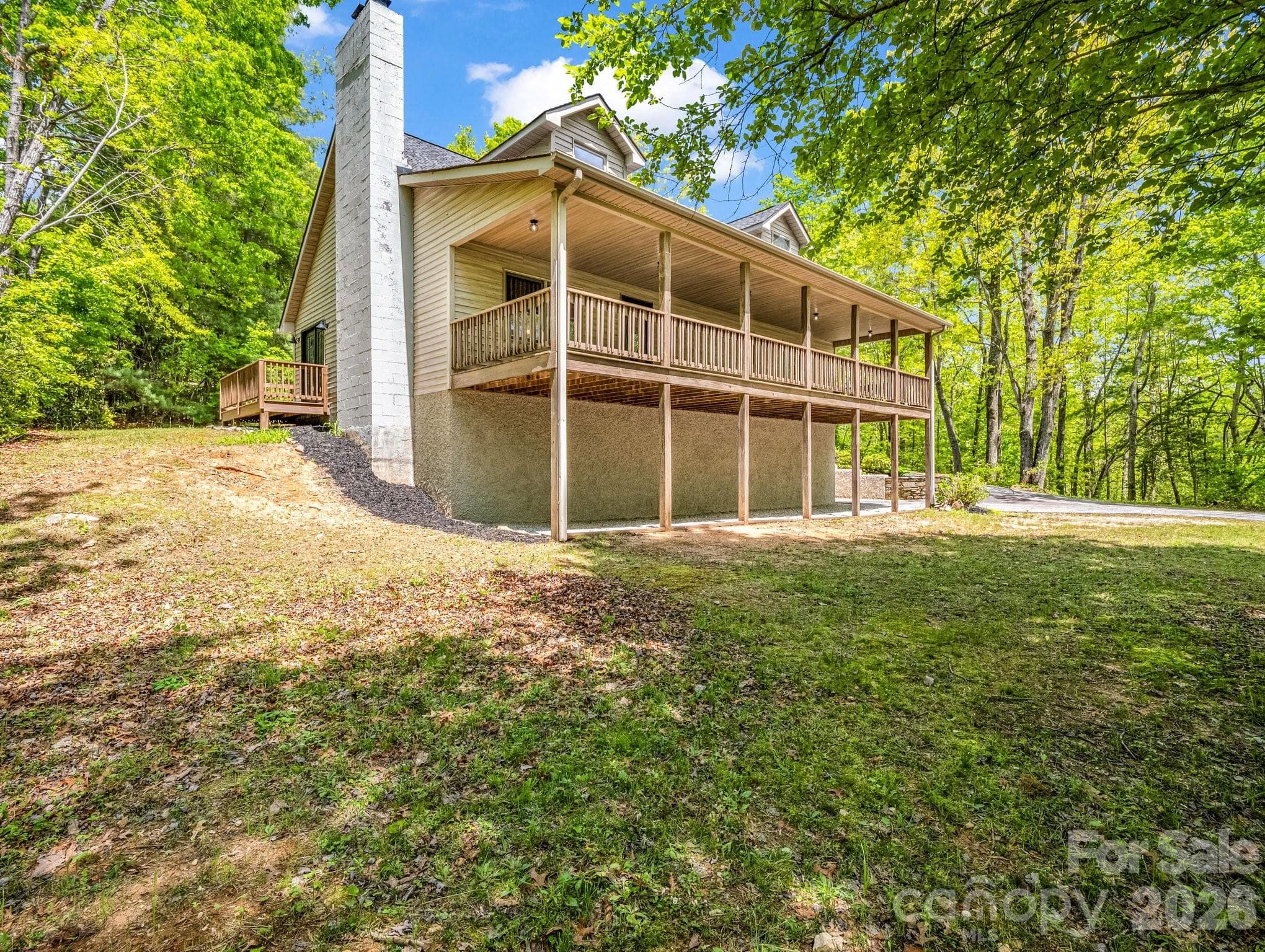 covered deck looking out into a private mountain setting - 2304 Mountain Page Road, Saluda