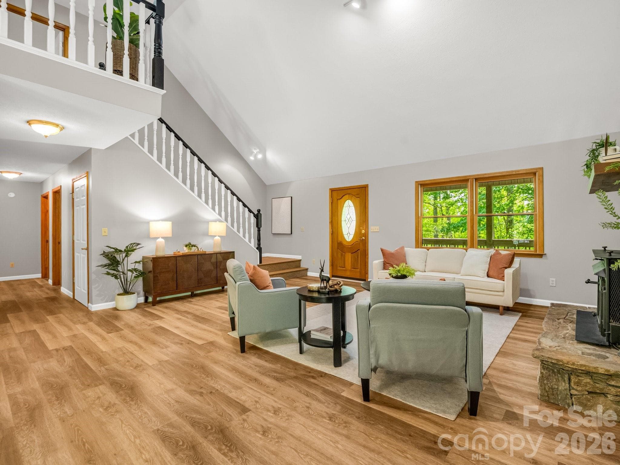 View of stairs to loft area above living room - 2304 Mountain Page Road, Saluda