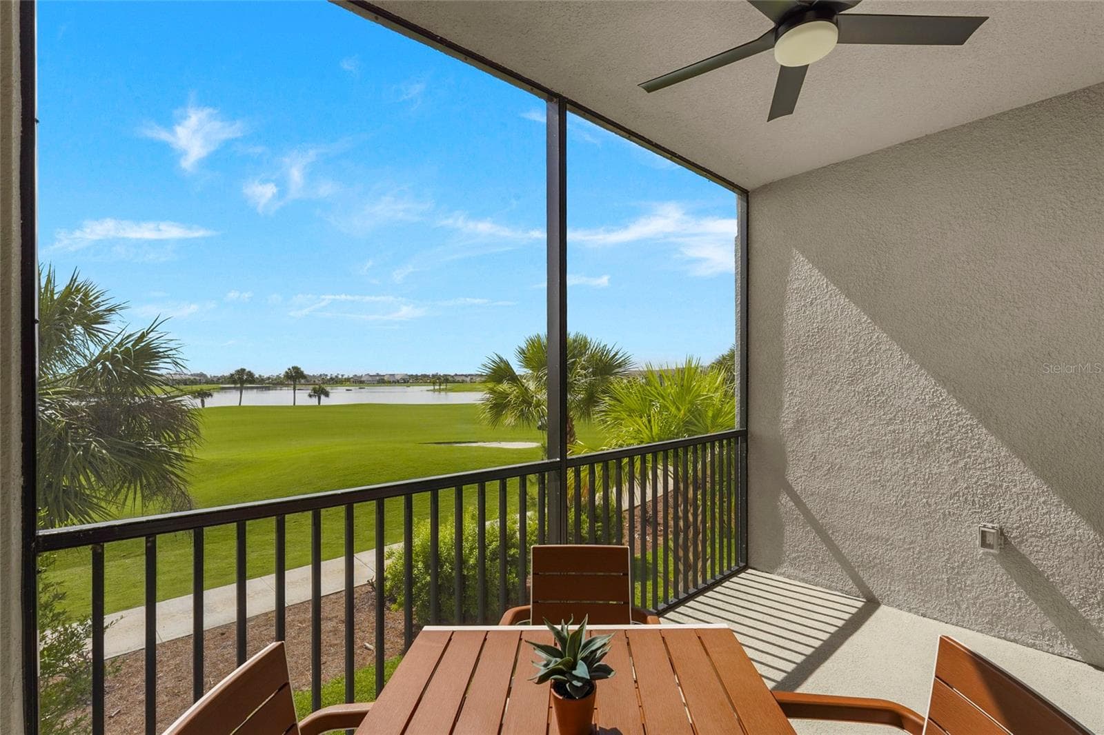 Screened lanai overlooking the golf course and lake - 43985 BOARDWALK LOOP #2124, PUNTA GORDA