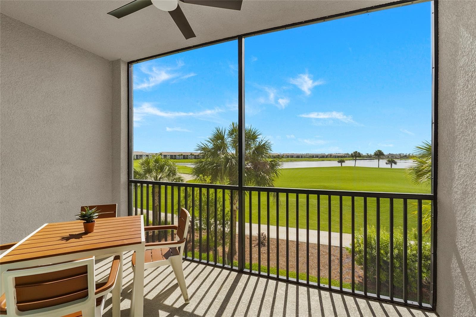 Screened lanai overlooking the golf course and lake - 43985 BOARDWALK LOOP #2124, PUNTA GORDA
