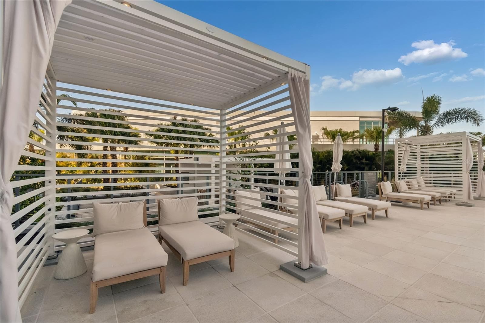Poolside cabanas provide shaded spaces for relaxing and entertaining - 400 CENTRAL AVE #2505, ST PETERSBURG