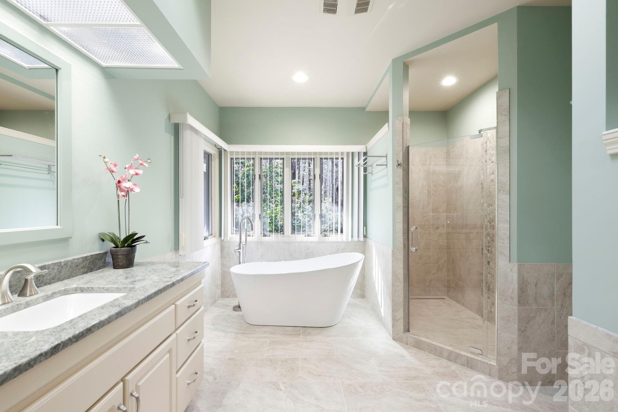 Updated primary bath with soaking tub and walk-in tile shower - 100 Elmridge Drive, Flat Rock