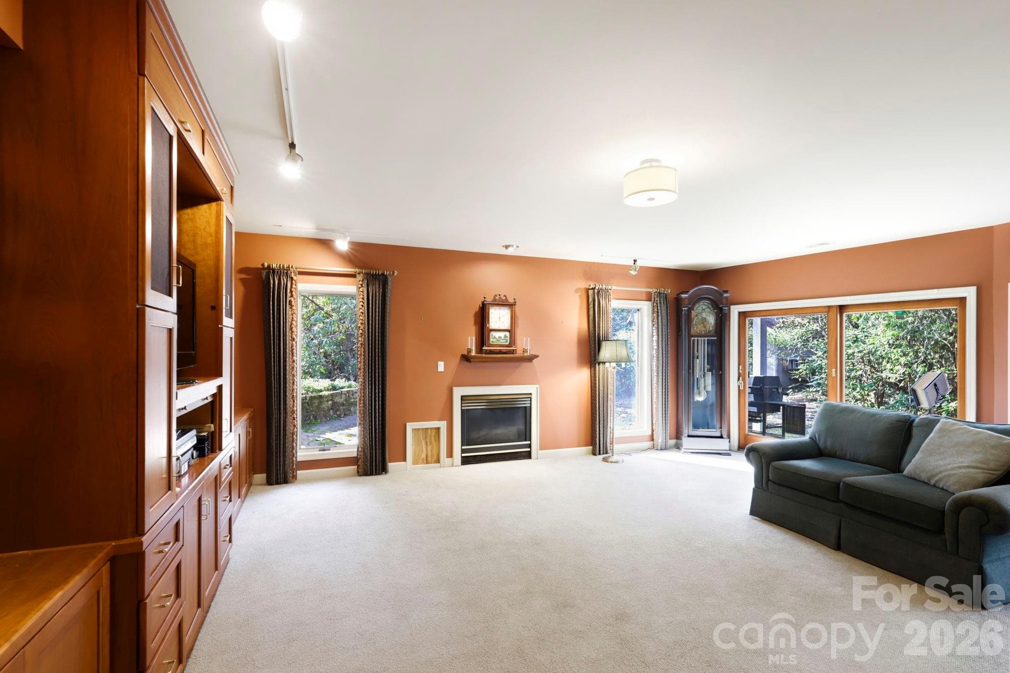 Lower level den with beautiful built-ins and gas fireplace - 100 Elmridge Drive, Flat Rock