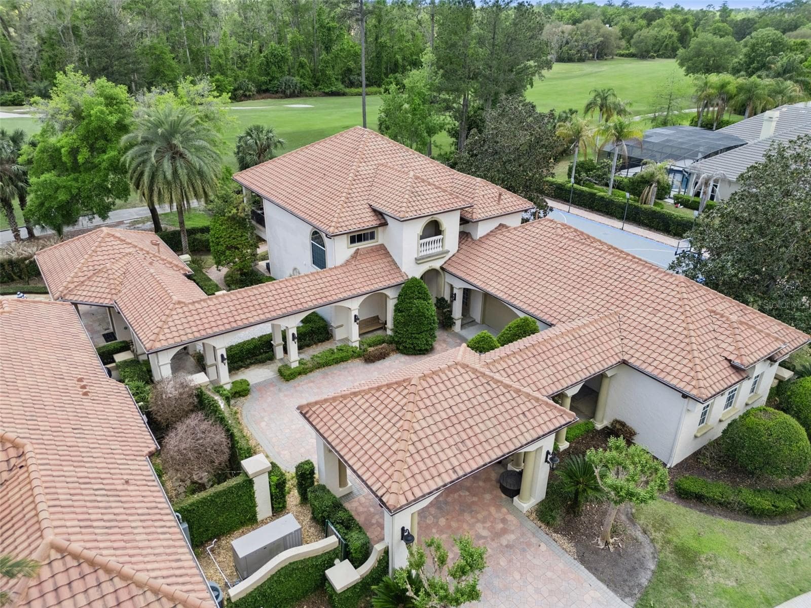 Separate Guest House with a 2 car garage and a golf cart bay with garage door on back side of the garage with a pavered path leading to the golf course. - 3545 LEGACY HILLS CT, LONGWOOD