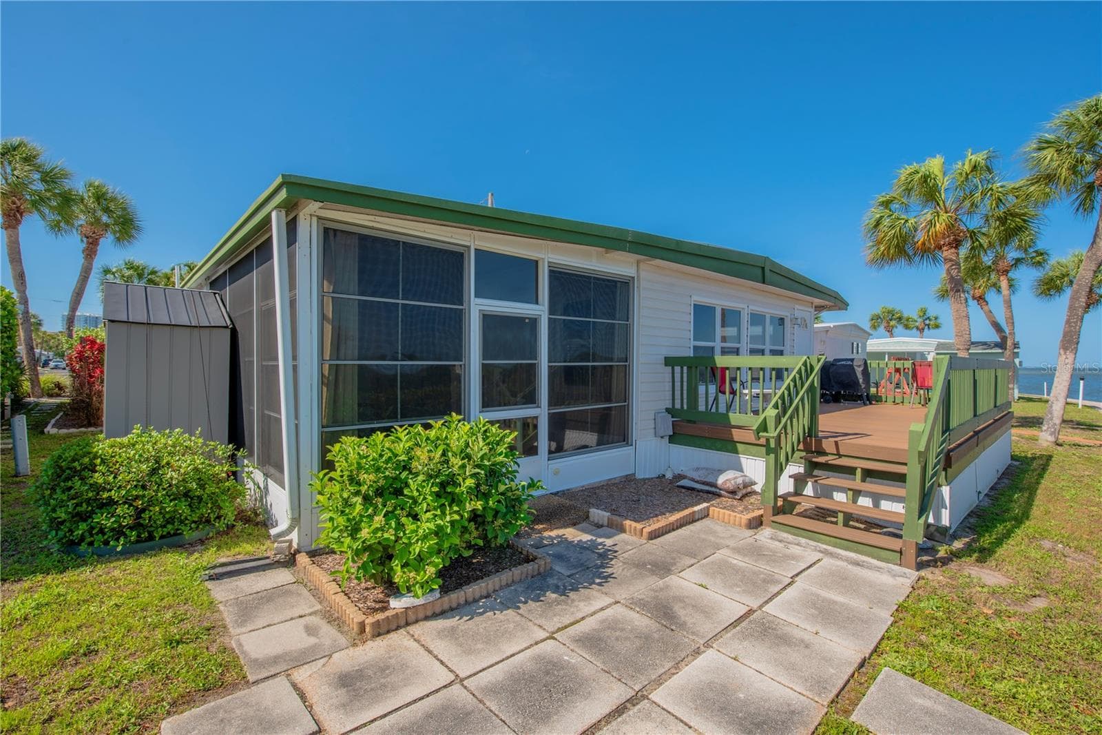 Patio off the screened room and deck. - 4851 W GANDY BLVD #23C, TAMPA