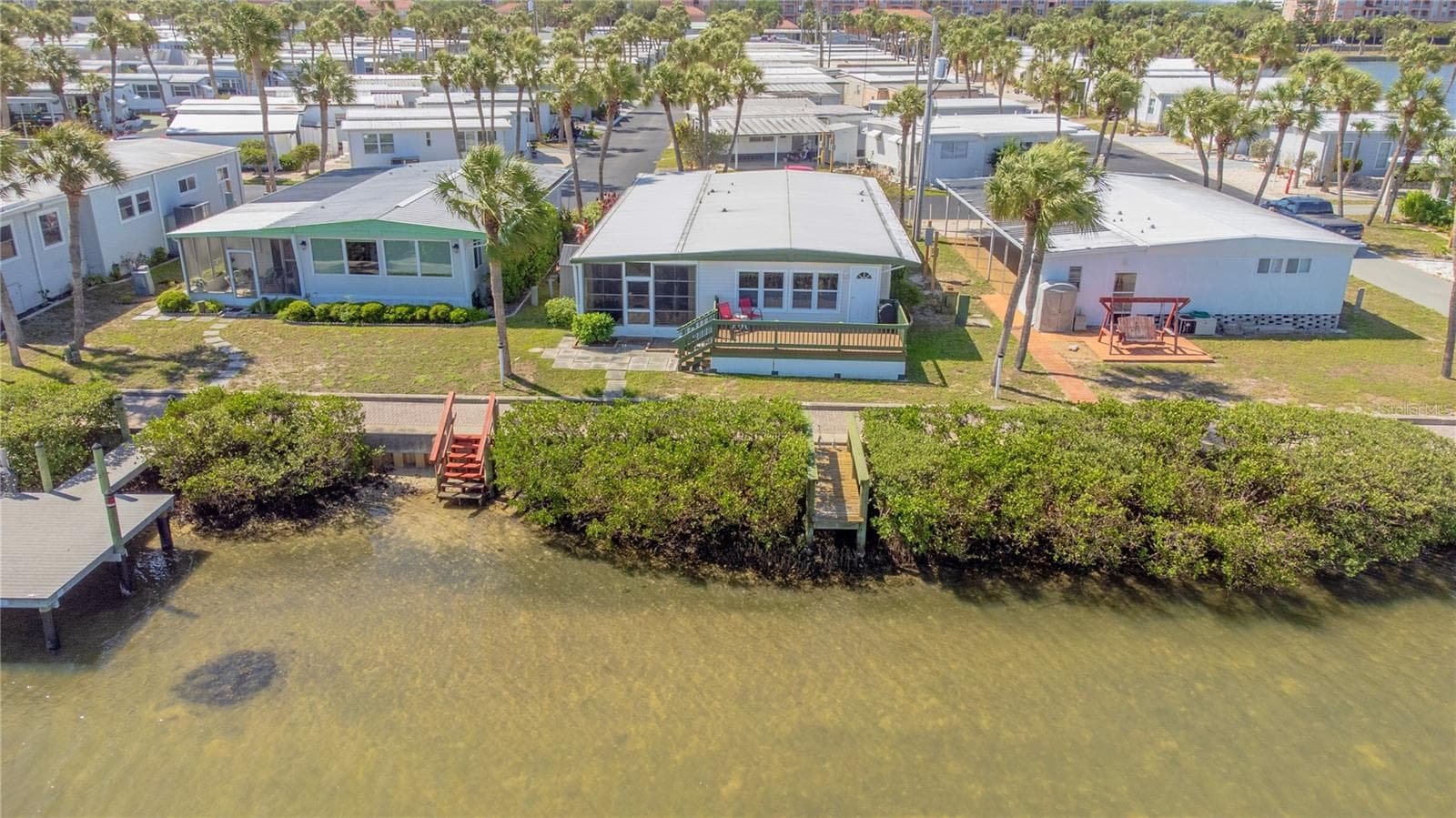 Rear of home with observation dock. - 4851 W GANDY BLVD #23C, TAMPA