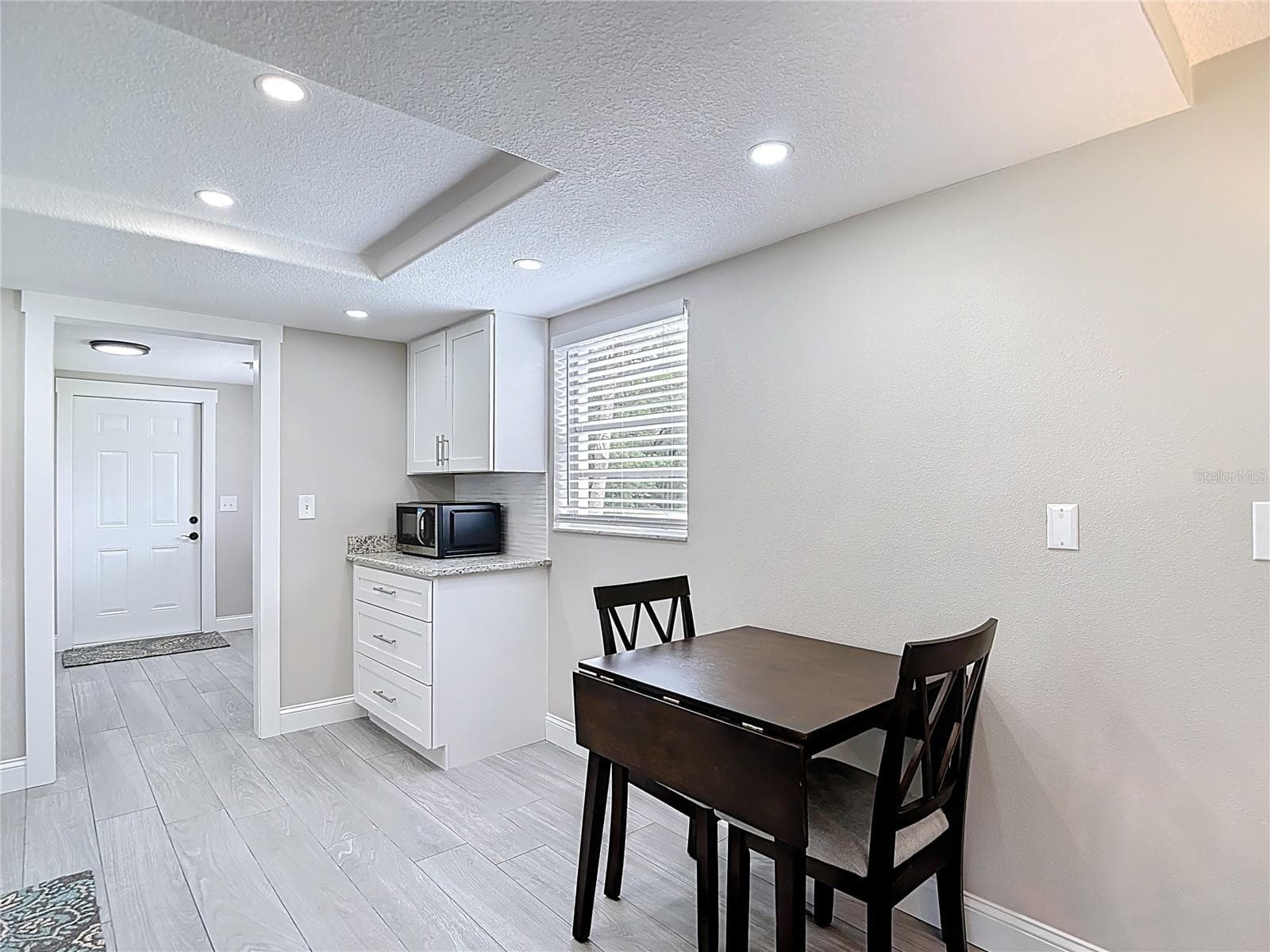 Table and chairs included in purchase! - 14306 GUAVA STREET, HUDSON