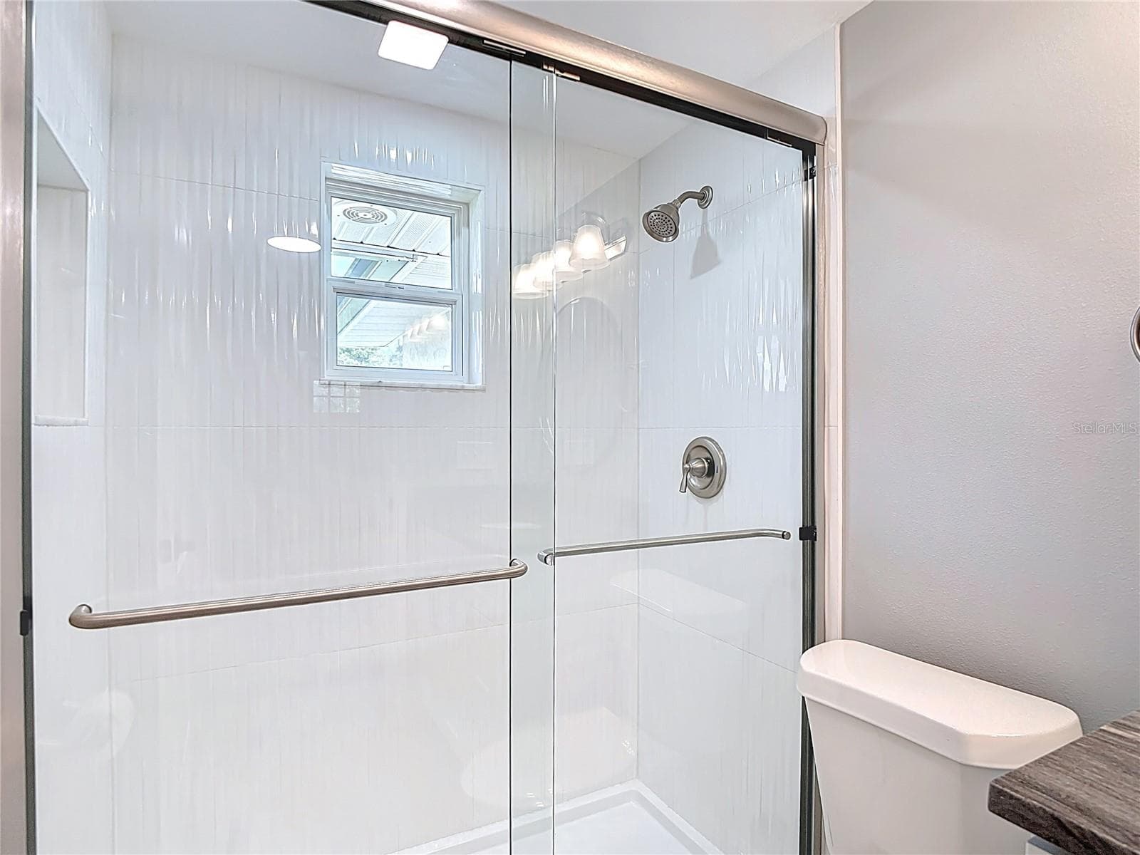 Wavy Tile shower stall with brushed nickel fixtures! Plenty of Light Too! - 14306 GUAVA STREET, HUDSON