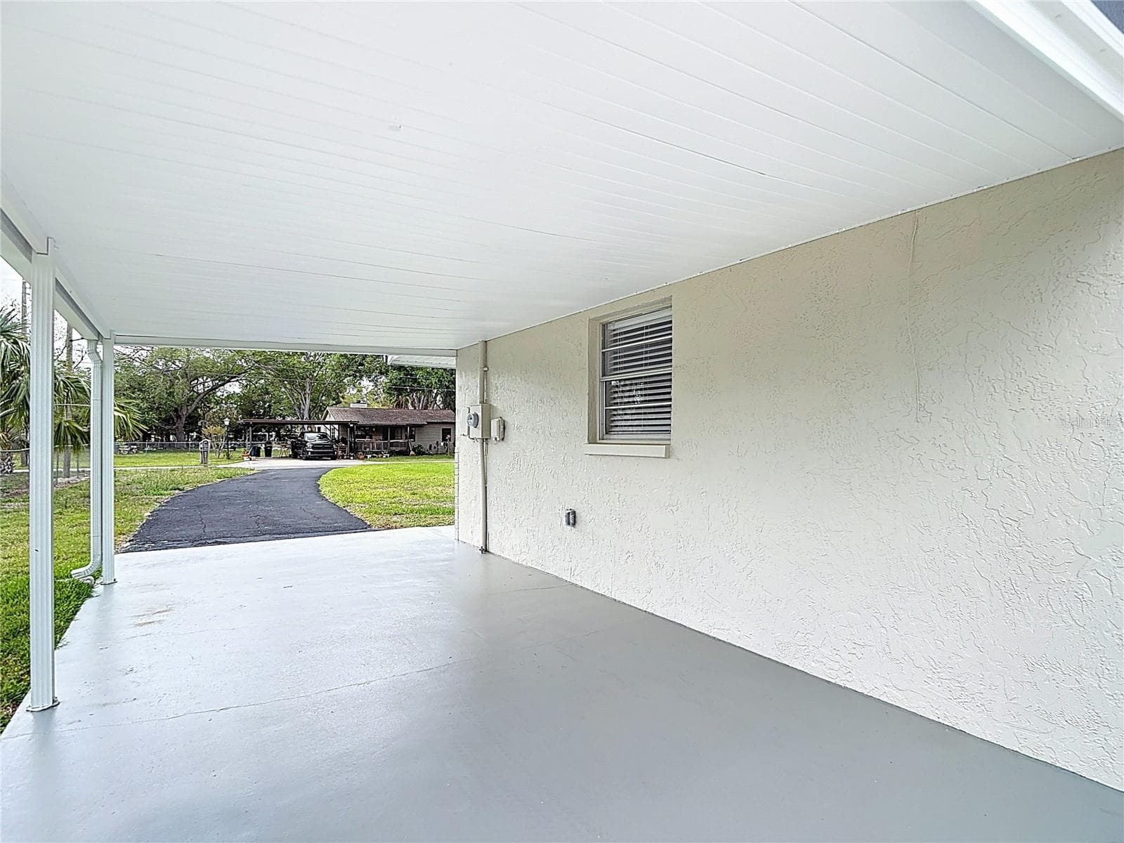 Carport with painted concrete floor! - 14306 GUAVA STREET, HUDSON