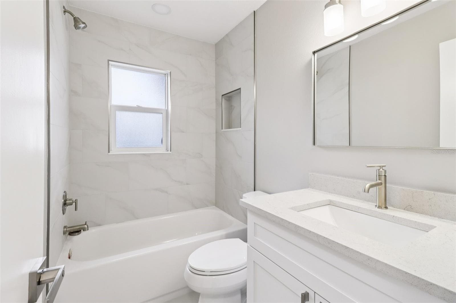 Second full bath. - 1412 DIGARMO TER, DELTONA