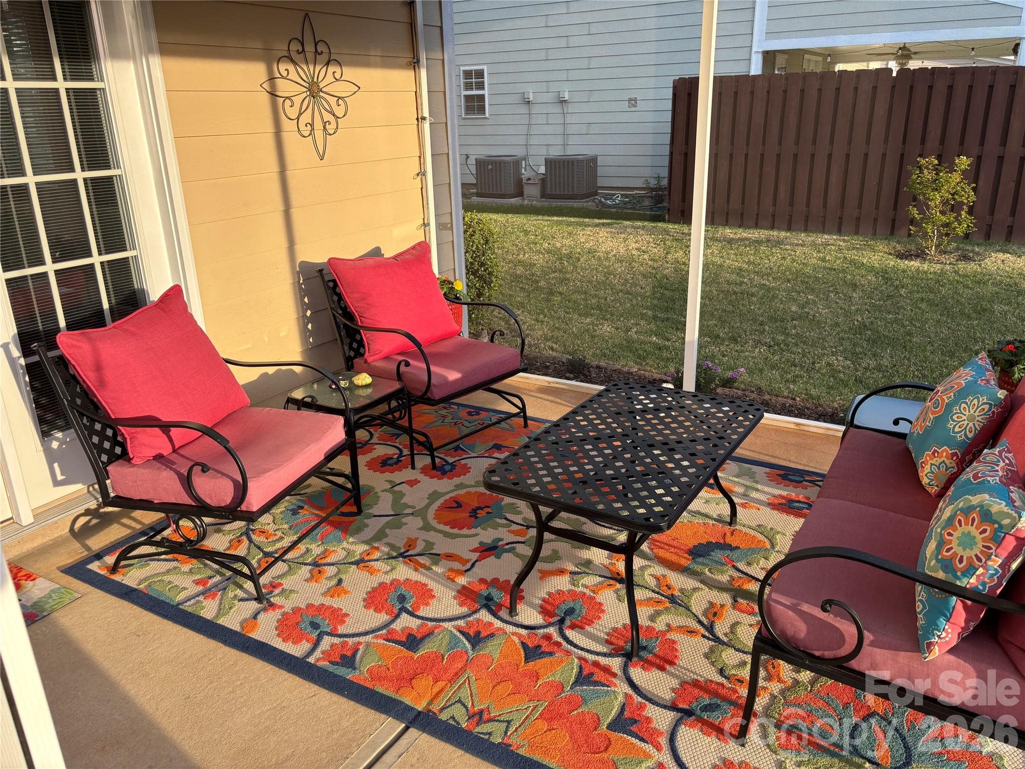 Relax and unwind in the screened-in porch or enjoy outdoor living on the cobblestone back patio, creating the perfect blend of comfort and charm. - Mooresville