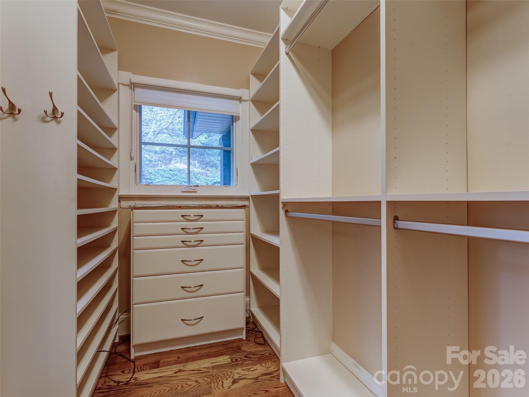 The walk-in closet features built in drawers, jewelry drawers, and plenty of hanging and shelf space. - 5 Stegall Lane, Asheville