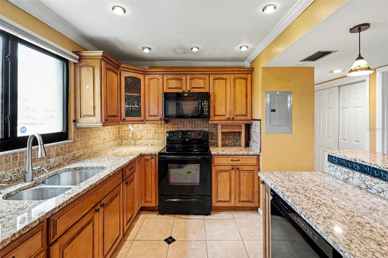 Kitchen (Newer Dishwasher, Impact resistant window with remote control blind, new granite) - 10755 VILLAGE CLUB CIR N #101, ST PETERSBURG