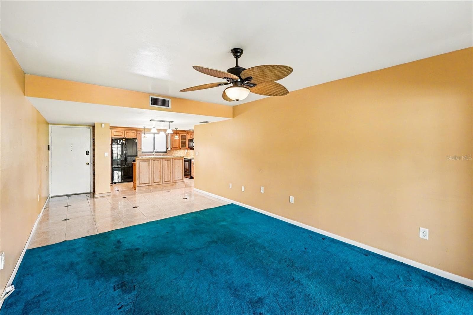 Living/Dining rooms towards Kitchen - 10755 VILLAGE CLUB CIR N #101, ST PETERSBURG