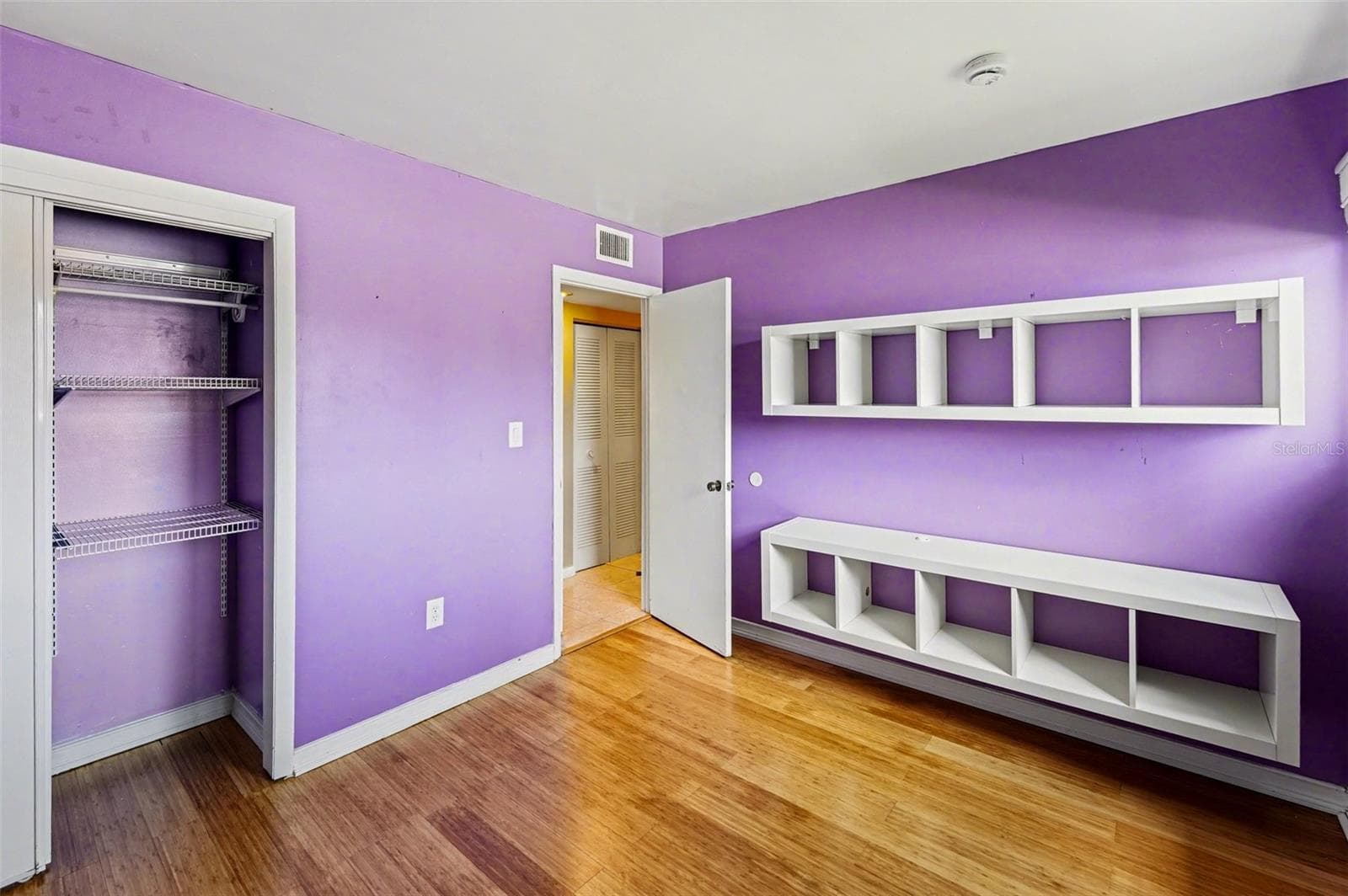 Bedroom 3 (High window, mounted shelving) - 10755 VILLAGE CLUB CIR N #101, ST PETERSBURG