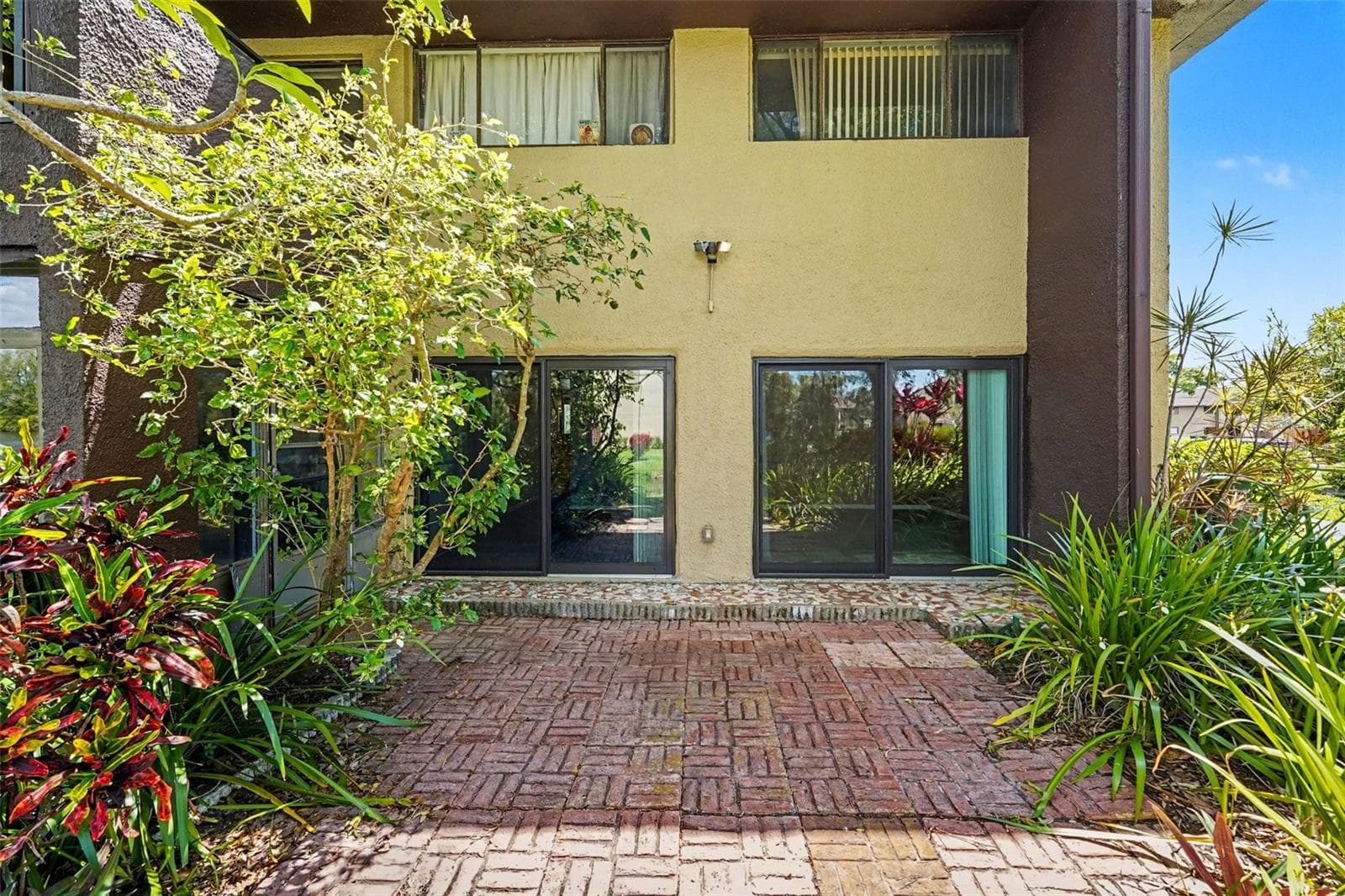 Back outdoor patio (Access to Bedroom 2 and Master Bedroom shown here) - 10755 VILLAGE CLUB CIR N #101, ST PETERSBURG