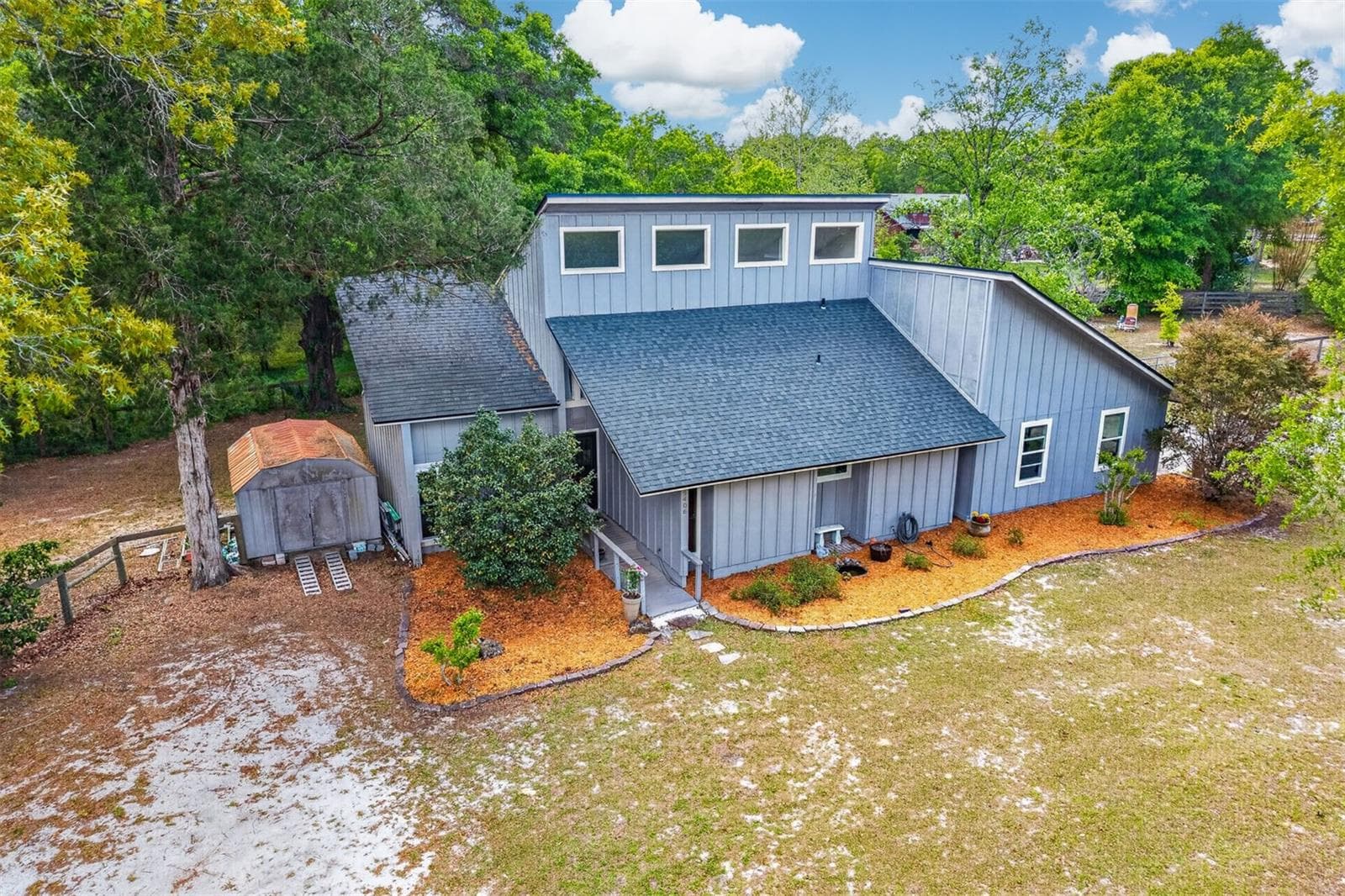 Front of house (mulch has been replaced with dark mulch) - 9406 SW 78TH CT, GAINESVILLE