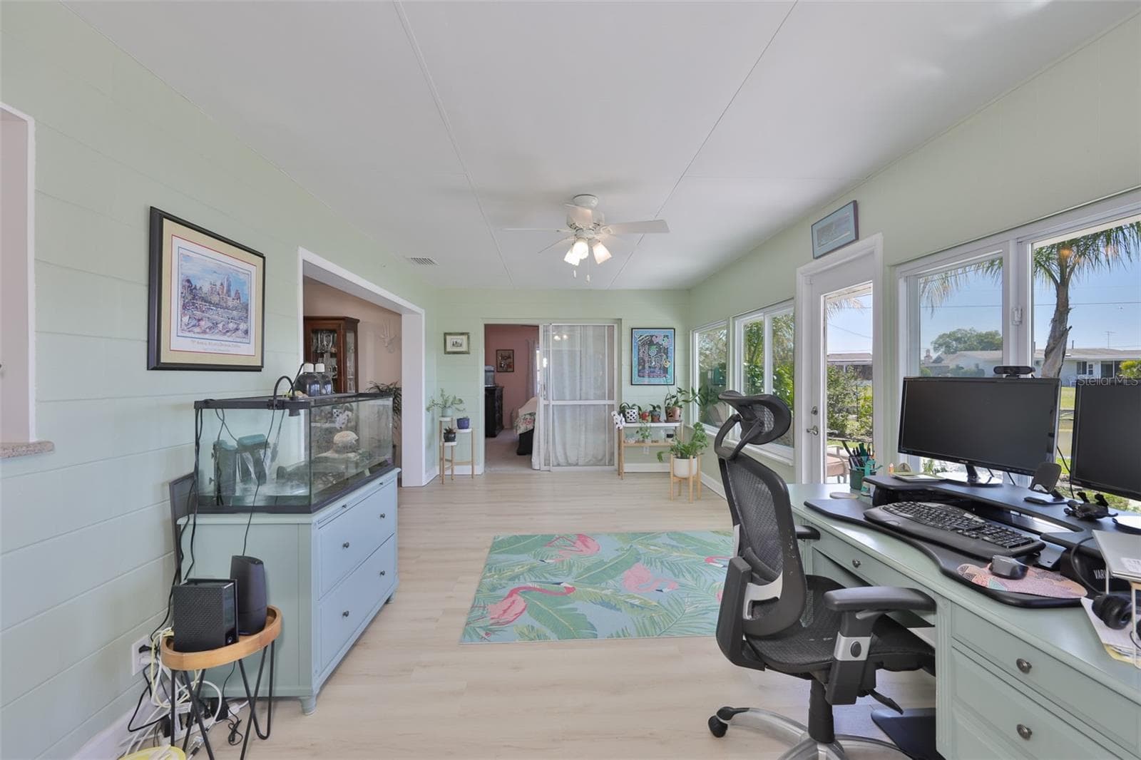 Enclosed Lanai - Bight, Provides Tons of Work or Fun Space - 1704 DANBURY DR, SUN CITY CENTER