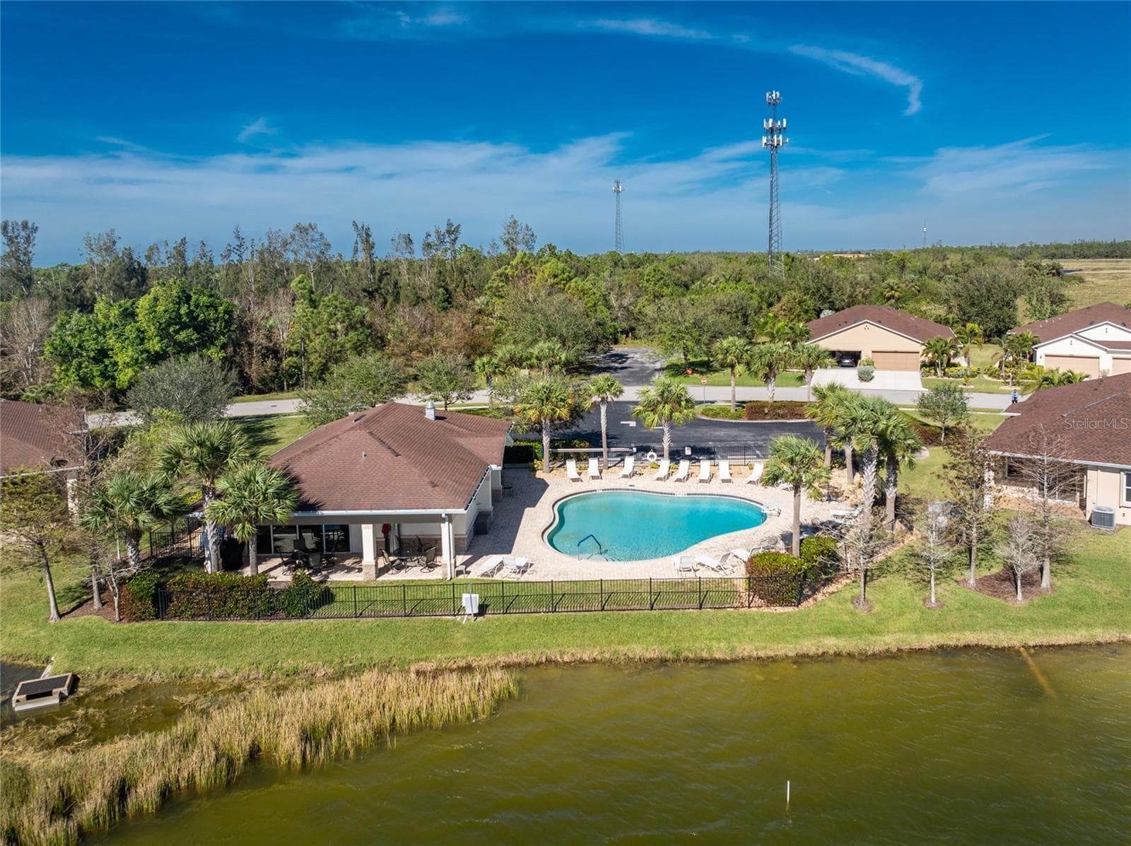 Clubhouse, pool, & lake - 8834 TUSCANY ISLES DR, PUNTA GORDA
