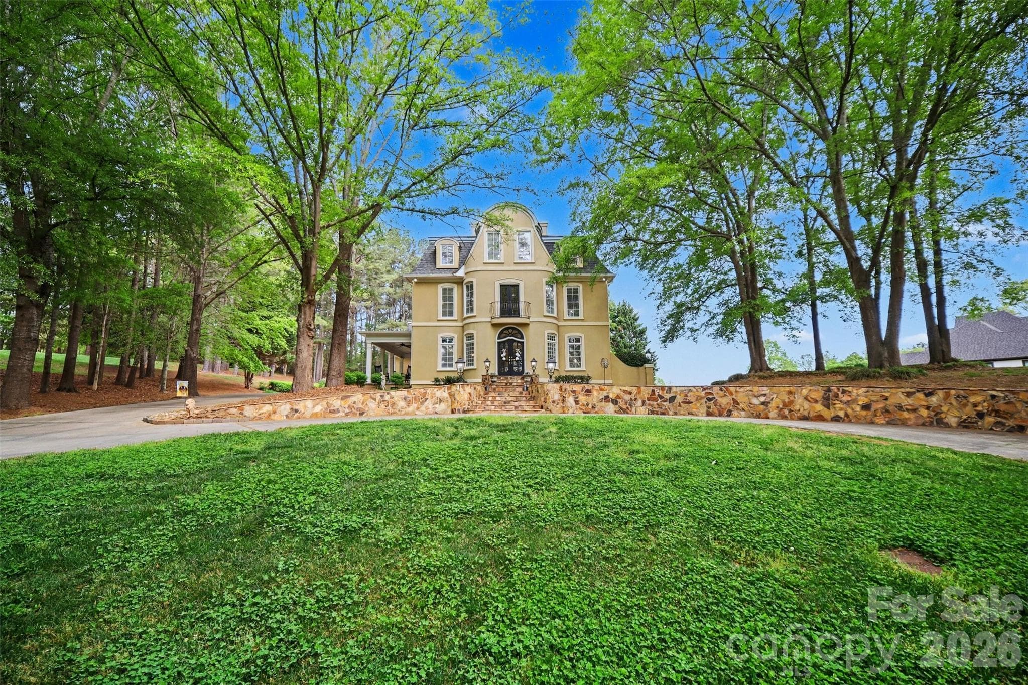 Circle drive and stone wall entrance welcome you to this beautiful estate home! - Shelby