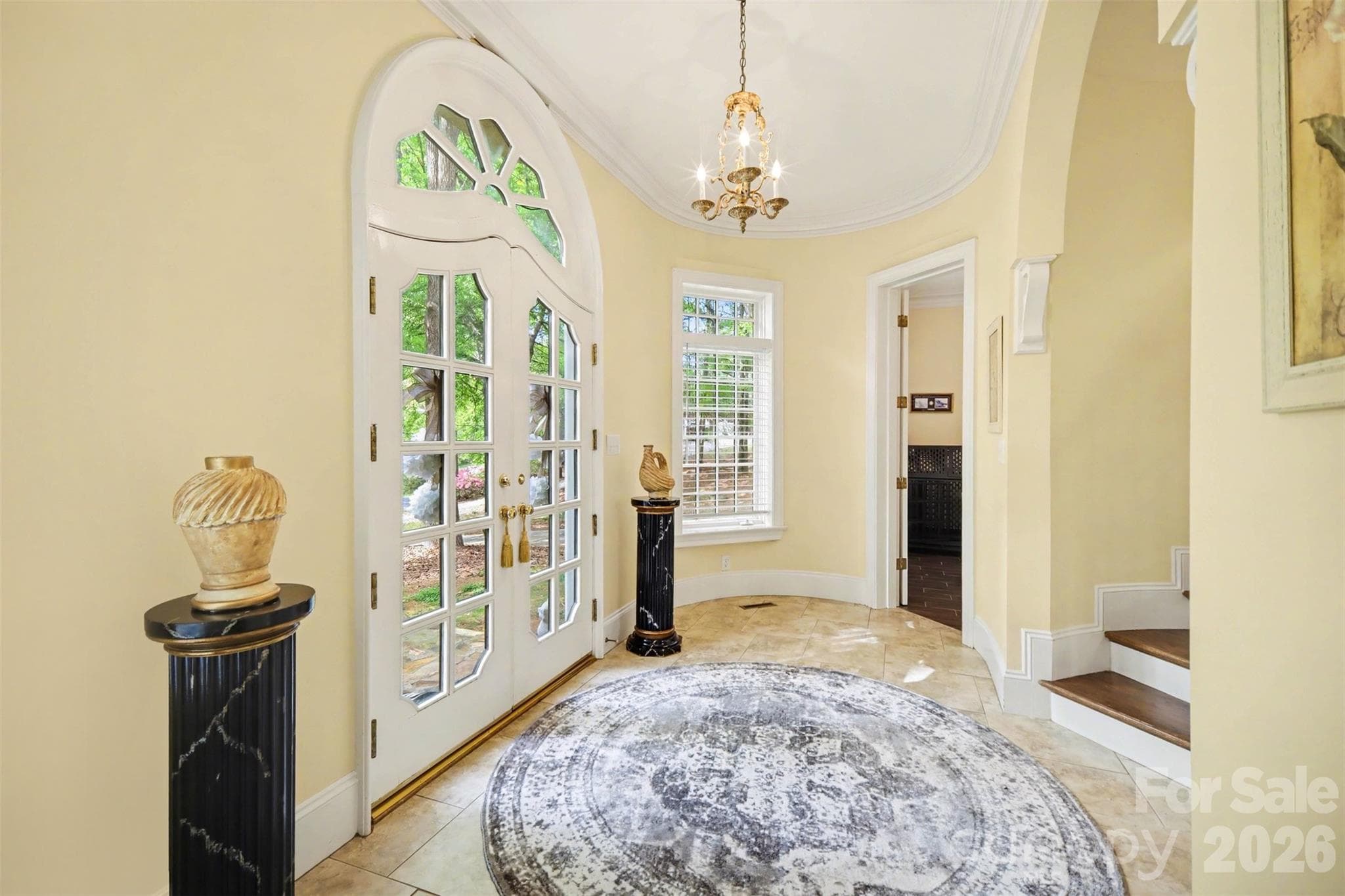 Foyer features curved walls and arched openings - Shelby