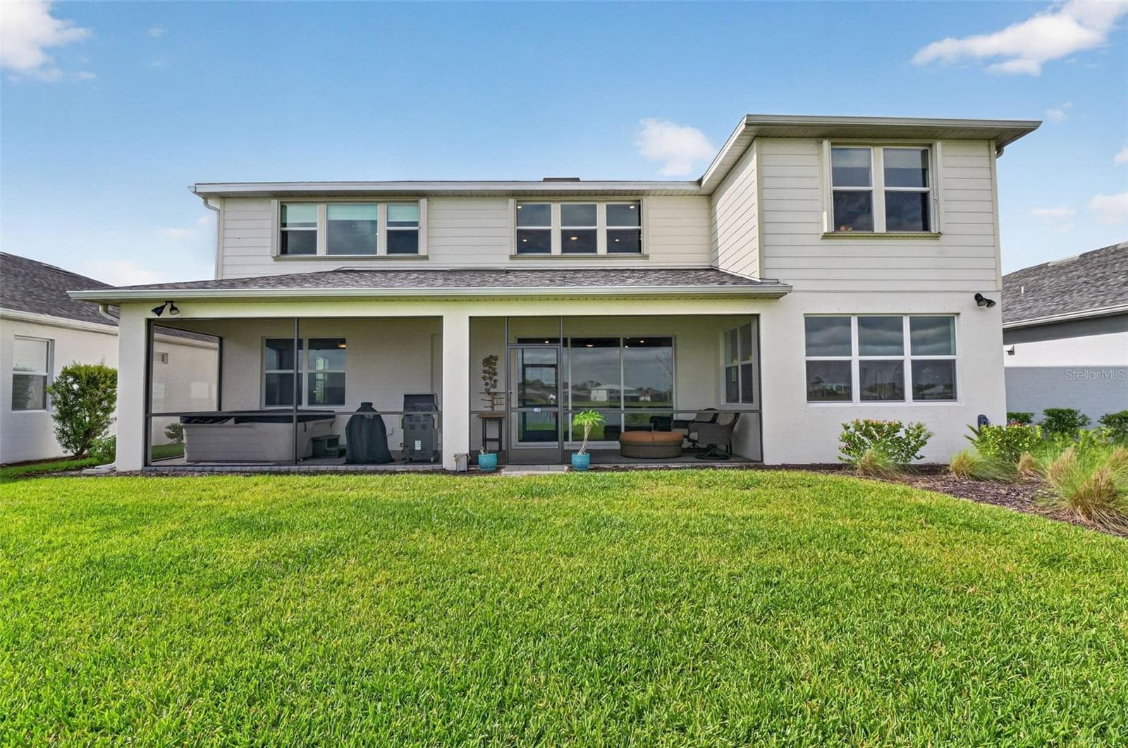 back of home- extended back patio screened in - 42581 ATLAS DR, PUNTA GORDA