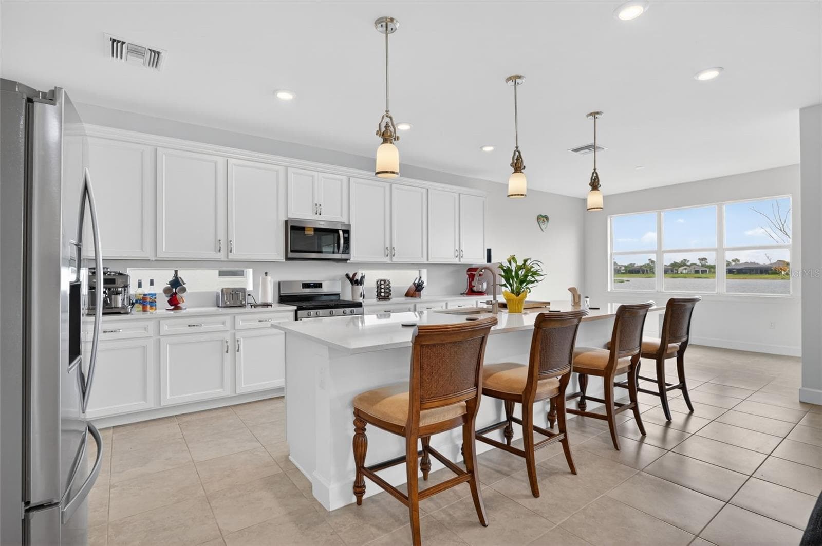 Kitchen with amazing island & cooking space - 42581 ATLAS DR, PUNTA GORDA