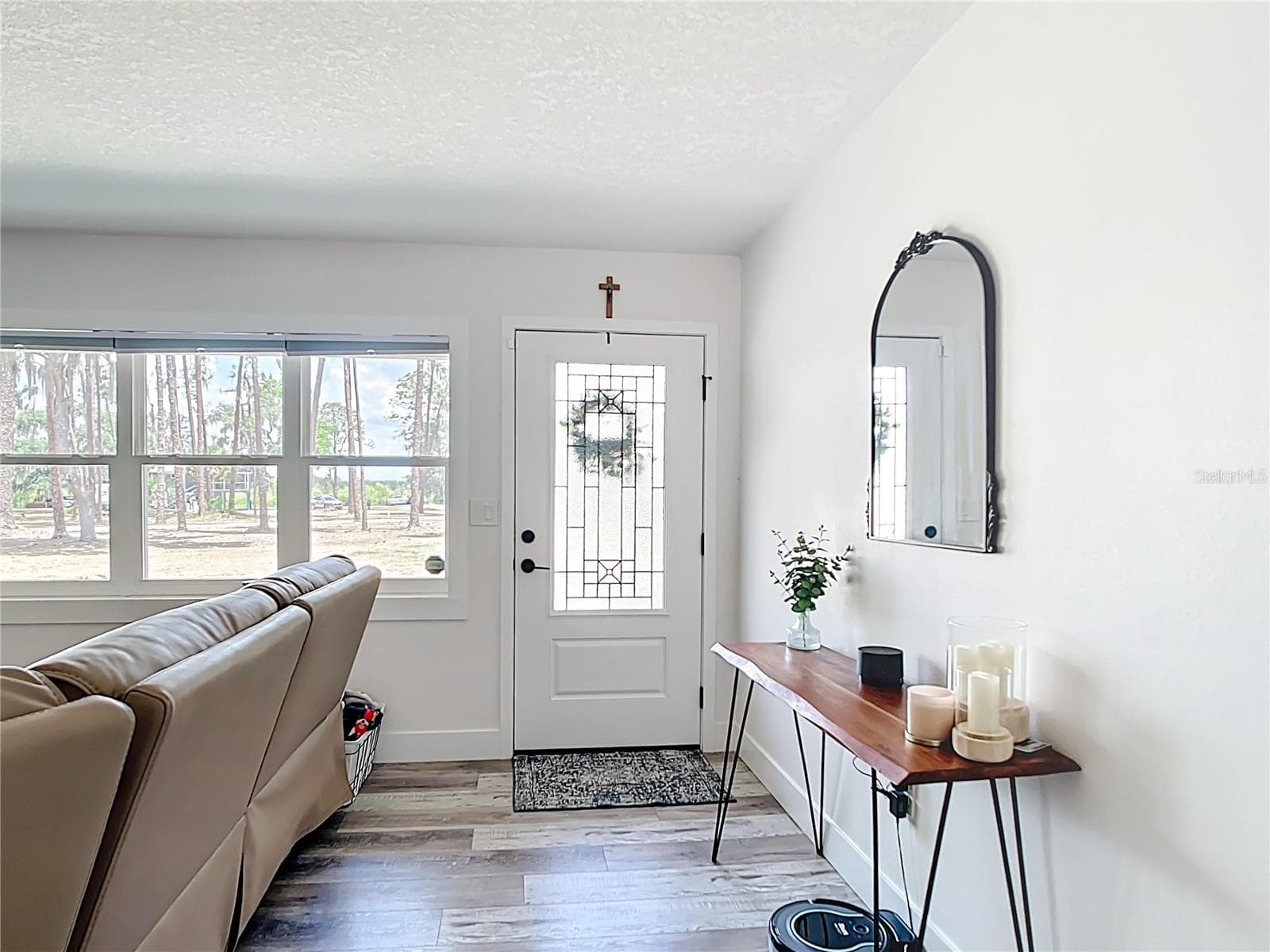 Entry into home showing new front door and windows - 7374 CIRCLE DR, LADY LAKE