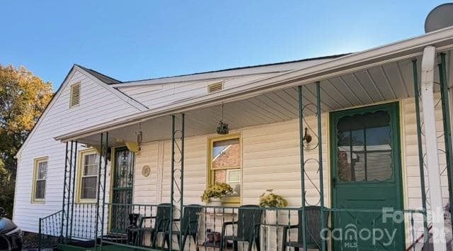 Side Porch with entrance to home. - Charlotte