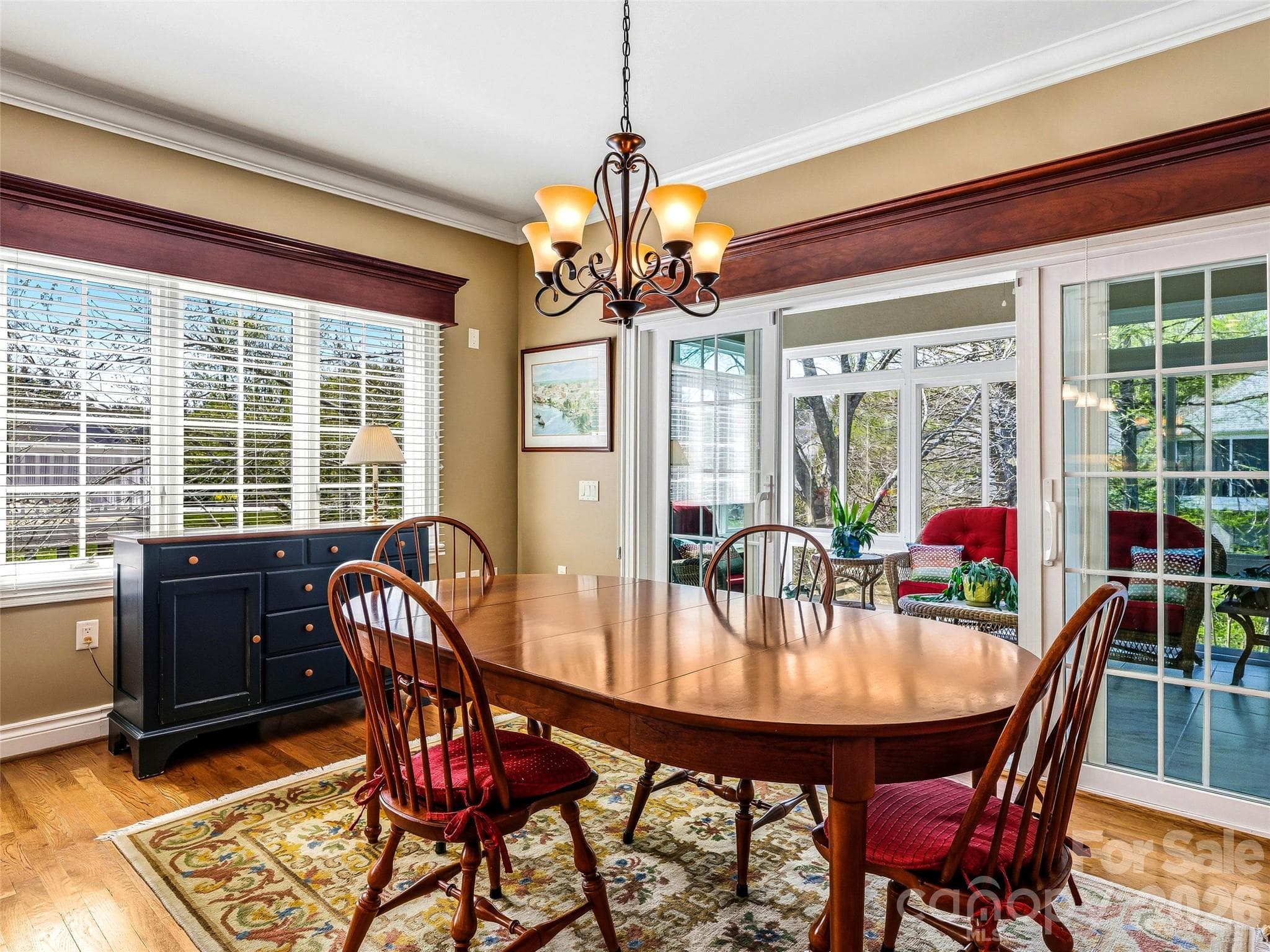 The eat-in kitchen leads out to an all-season porch with heating and AC provided by a mini-split. - 33 Tiverton Lane, Asheville