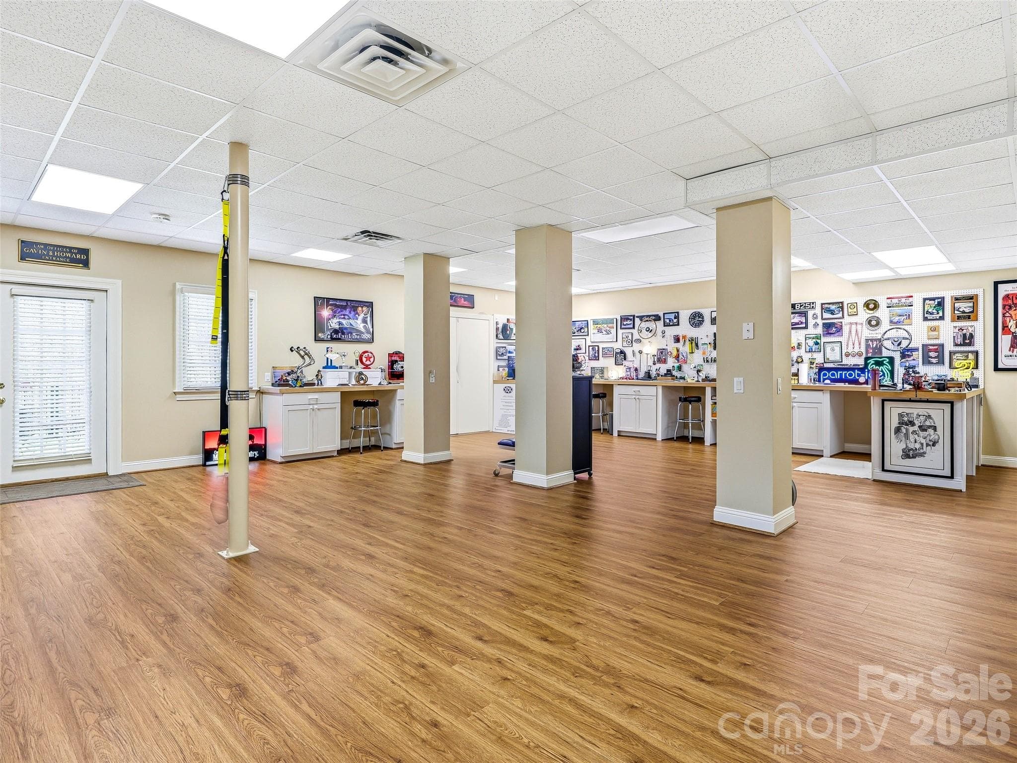 Just imagine all the uses for this huge finished basement with new luxury vinyl flooring! - 33 Tiverton Lane, Asheville