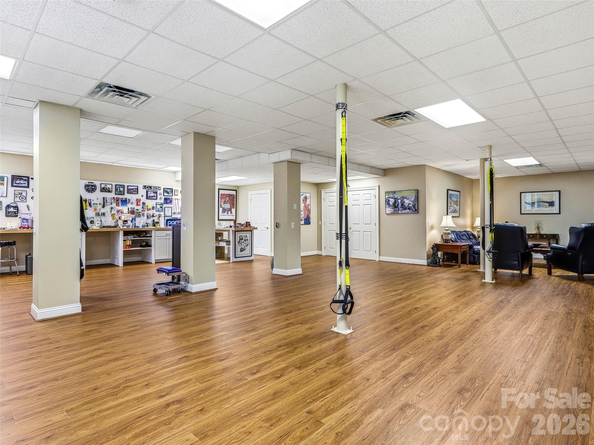 There is plenty of room for entertainment, exercise, a workshop, den, TV room, whatever your heart desires! There is also a half bath and two large unfinished storage areas with shelving. - 33 Tiverton Lane, Asheville