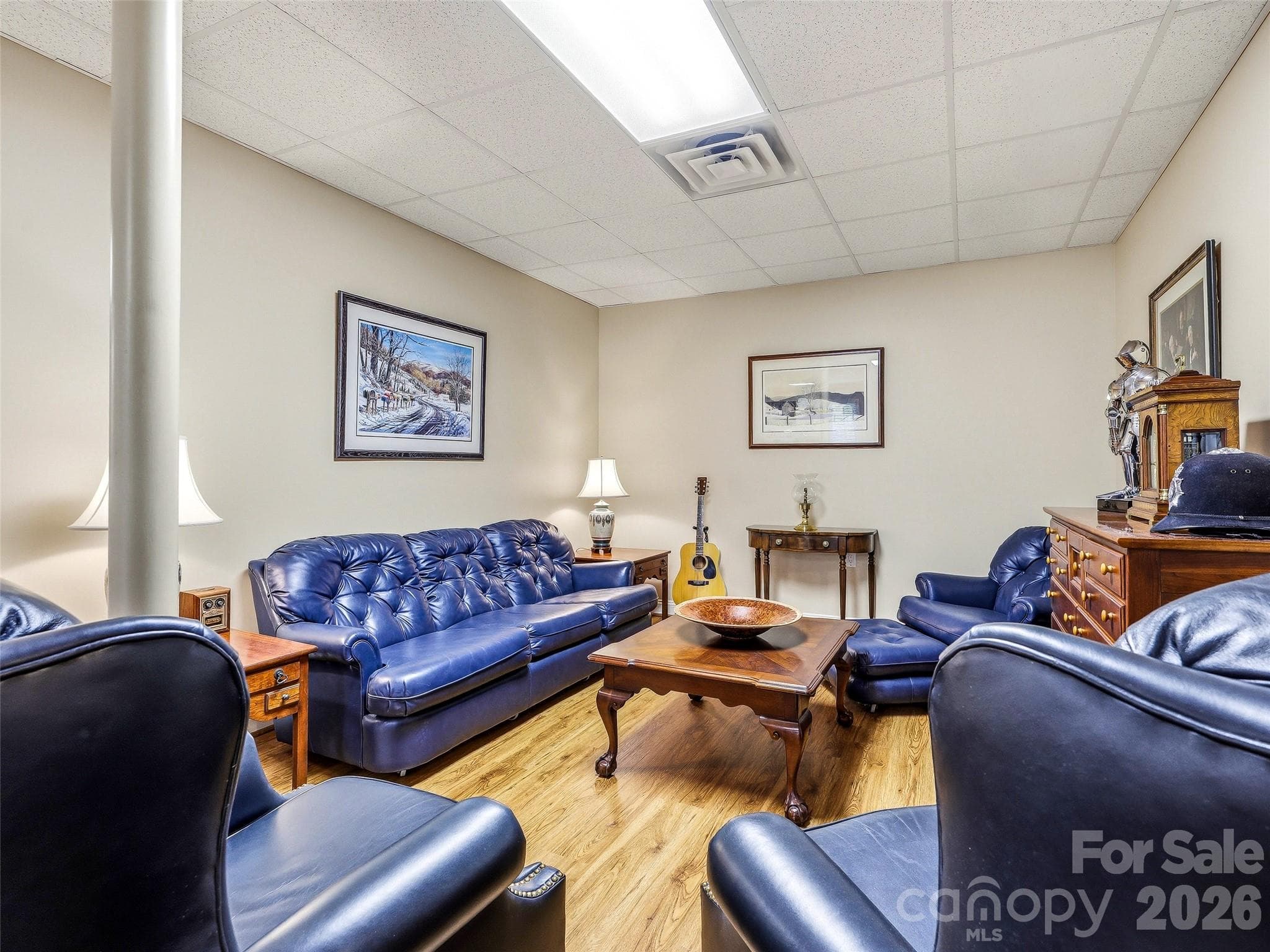 The finished basement features an area perfect for use as a TV room or study area. - 33 Tiverton Lane, Asheville