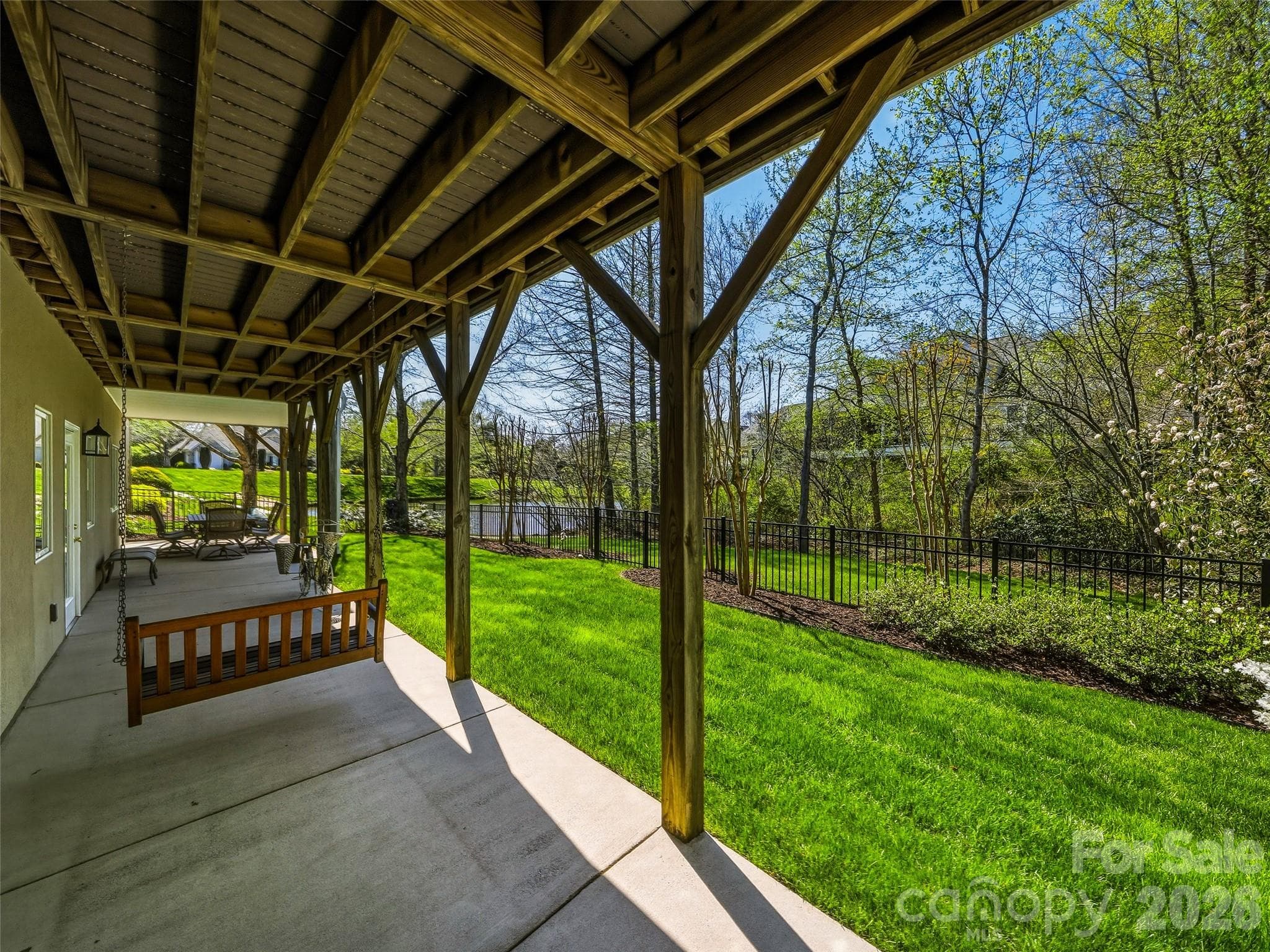 Lawn maintenance is provided by the HOA, even within the fenced backyard. - 33 Tiverton Lane, Asheville