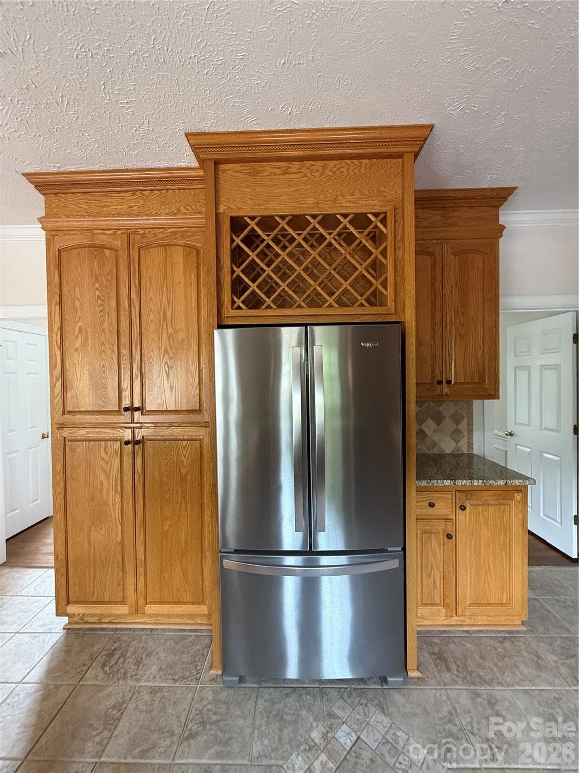 Kitchen with left side double door pantry style cabinets with roll-outs - 8219 Deer Drive, Harrisburg