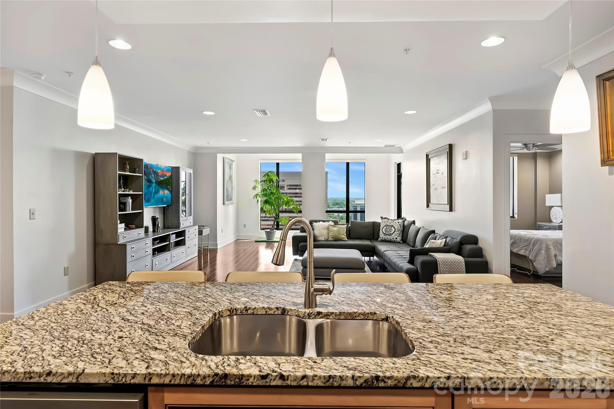 Large center island anchors the kitchen and living areas. - 222 S Caldwell Street, Charlotte