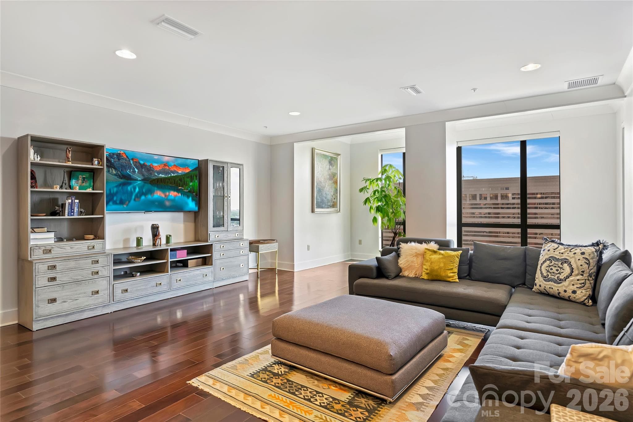 Expansive living spaces framed by skyline views and natural light. - 222 S Caldwell Street, Charlotte