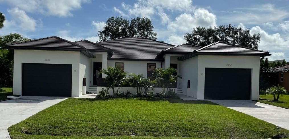 Front of completed duplex plan. The property is at slab only. - 2930 MAGDALINA DR, PUNTA GORDA